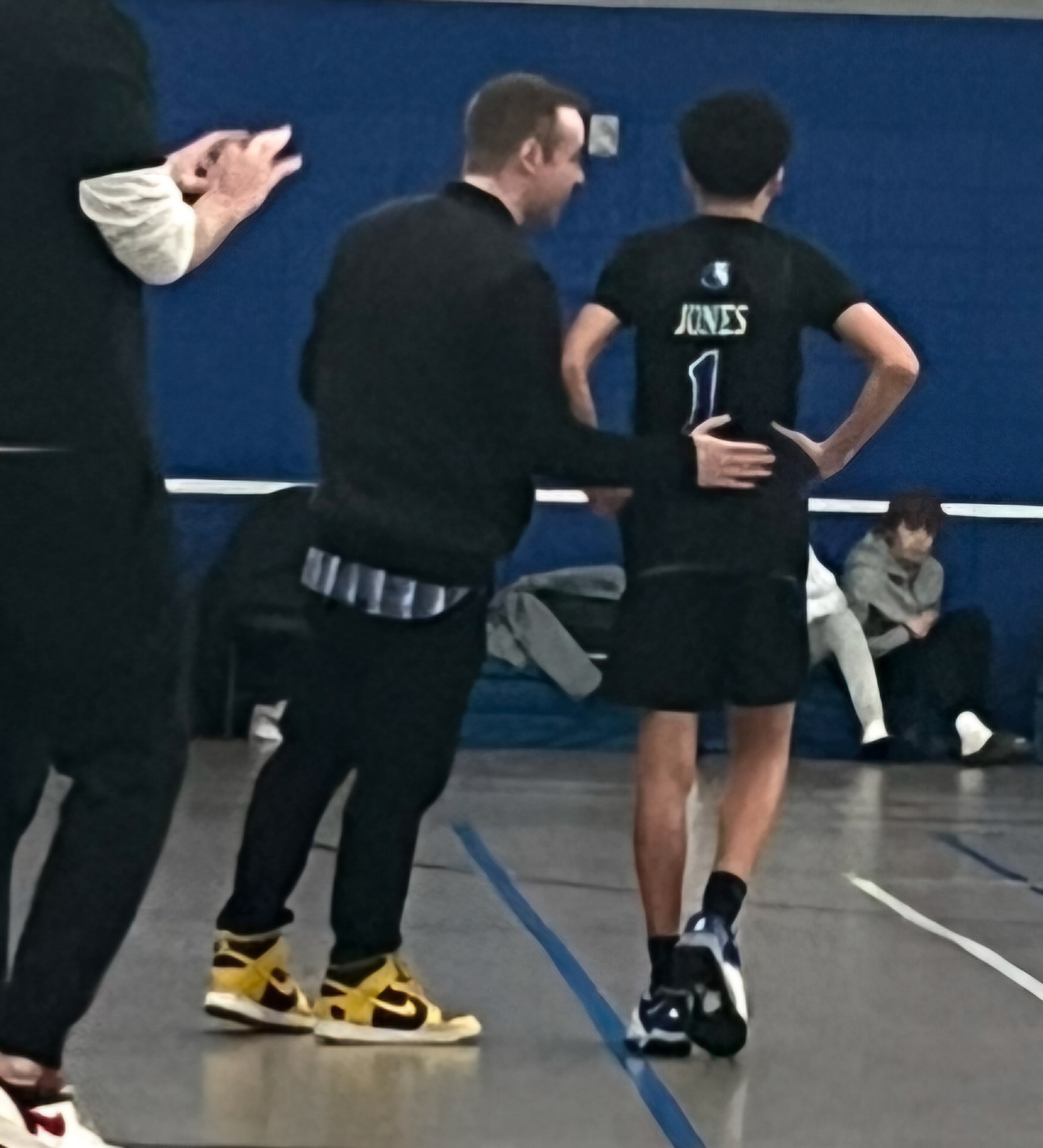 Bobby coaching a Hopkins player from the sideline