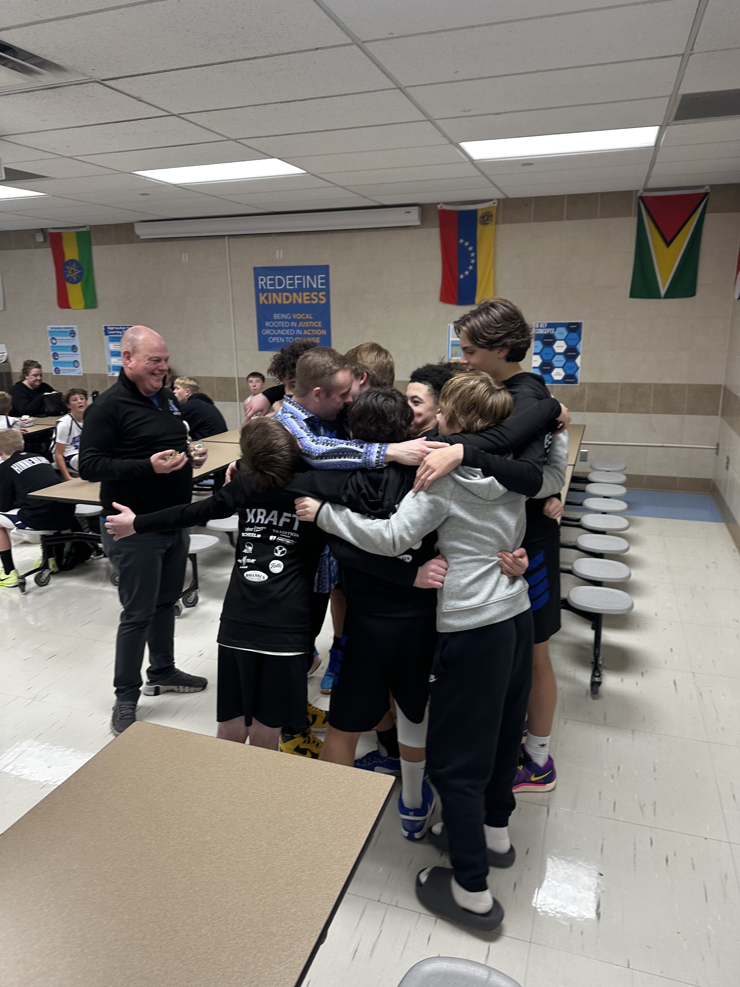 Hopkins players and coaches celebrating together after a game
